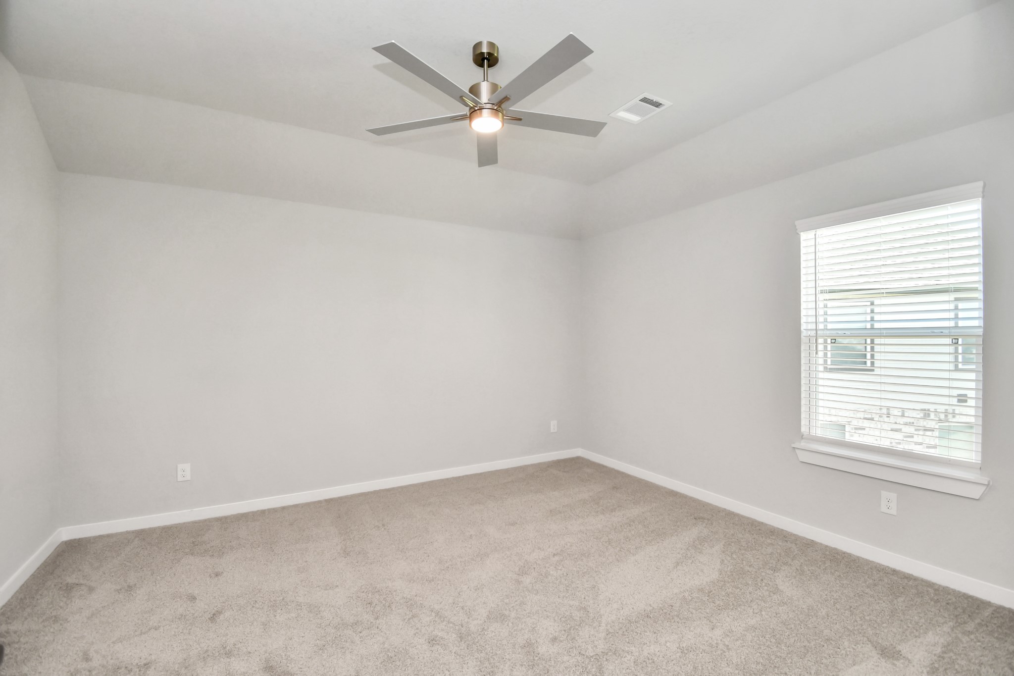 3106 Native Spg Drive Spring, TX 77373 - Photo 35 of 38 Secondary bedroom features plush carpeting, large windows that let in plenty of natural light, bright paint, and spacious closets. Sample photo of completed home with similar floor plan. Actual colors and selections may vary.