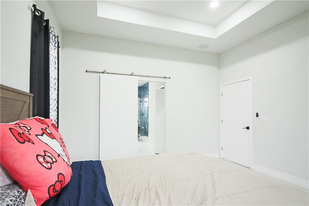 3902 4th Street Southwest Lehigh Acres, FL 33976 - Photo 21 of 34 Tray ceiling with recessed lighting