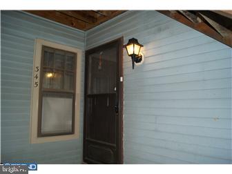 a view of hallway with wooden floor