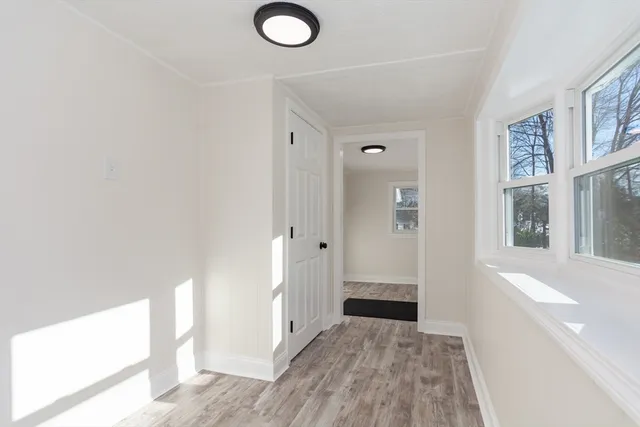 a view of a bathroom with wooden floor