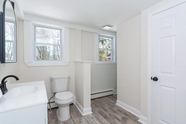 a white toilet sitting next to a bathroom sink