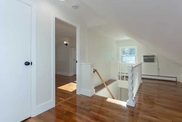 a view of entryway with wooden floor