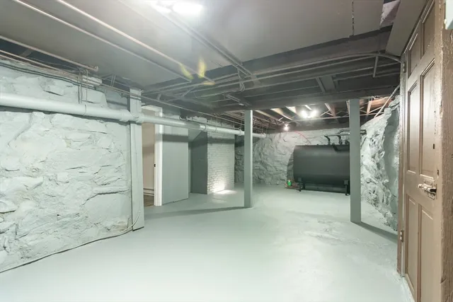 a view of empty room with wooden walls