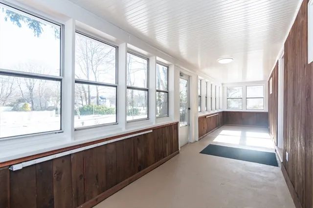 a view of an empty room with windows