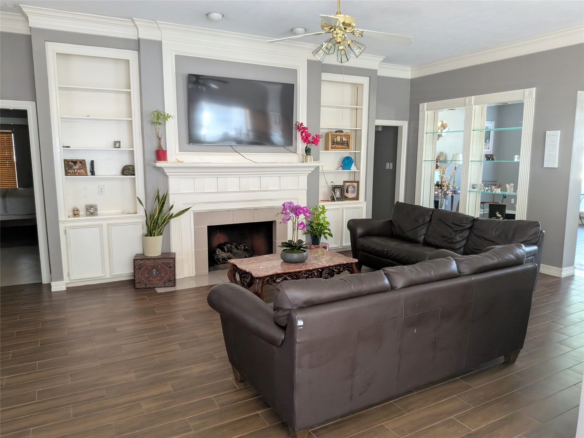 13107 Walnut Lake Road Houston, TX 77065 - Photo 13 of 23 a living room with furniture and a fireplace