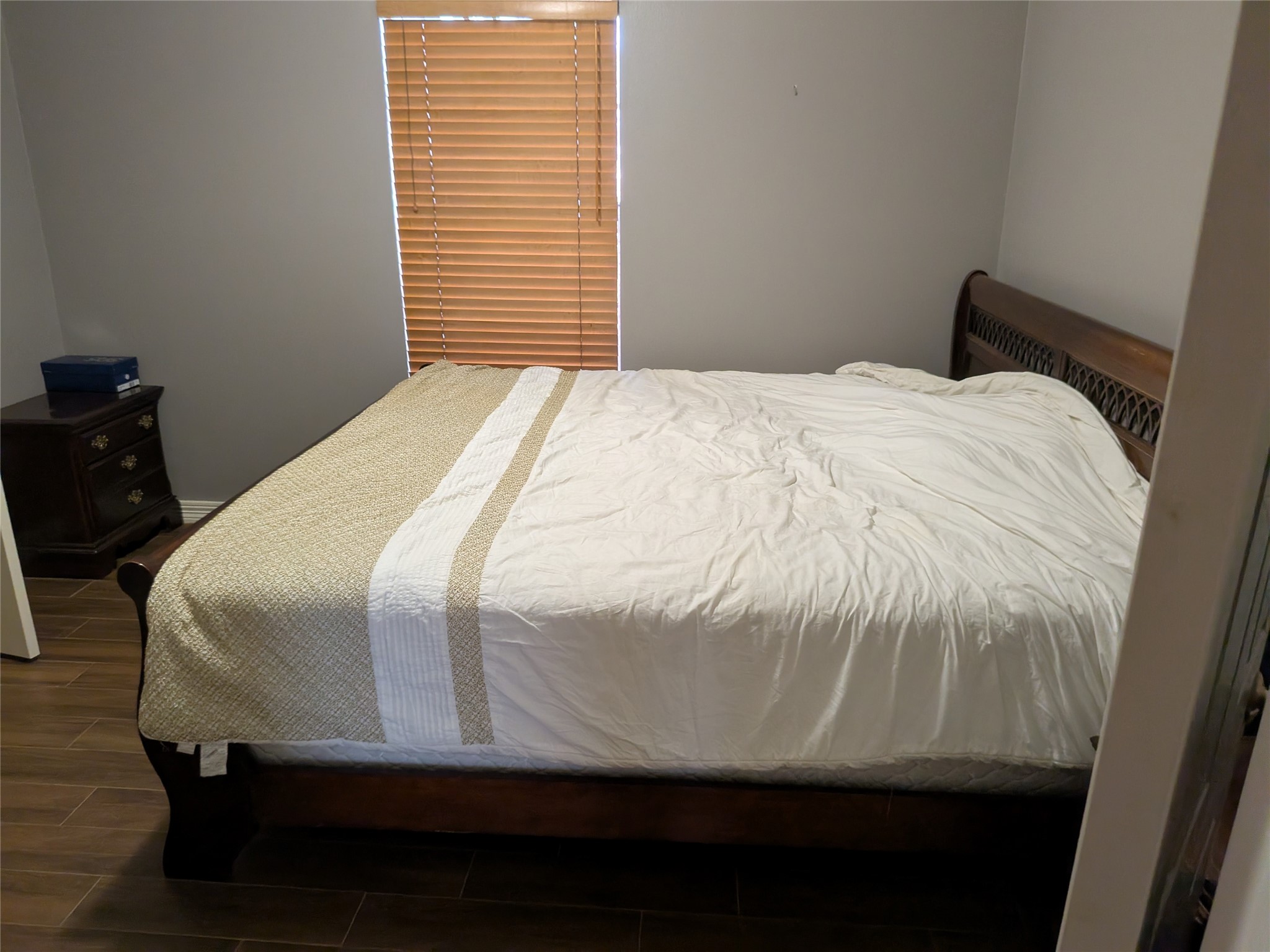 13107 Walnut Lake Road Houston, TX 77065 - Photo 17 of 23 a bedroom with a bed and a window