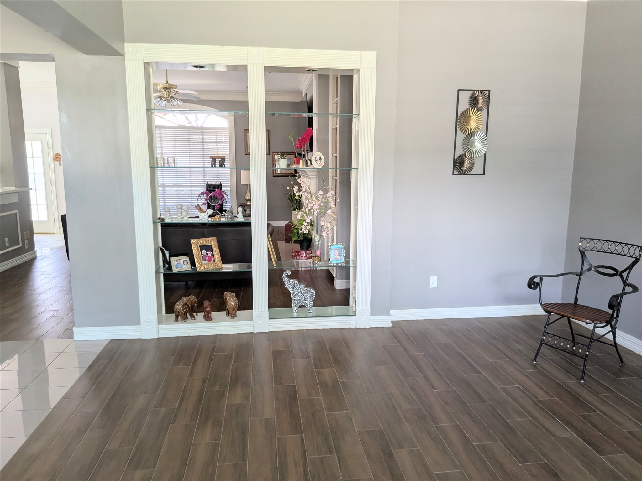 13107 Walnut Lake Road Houston, TX 77065 - Photo 6 of 23 a view of a room with wooden floor and furniture