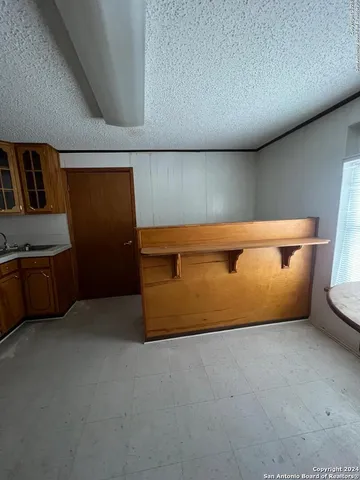a view of livingroom with hardwood floor and ceiling fan