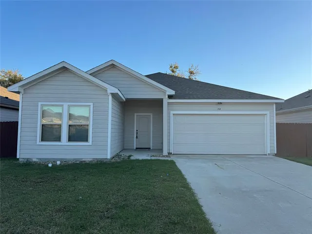a view of front of a house with a yard