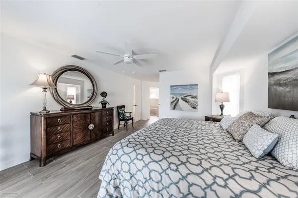 a view of room with a window and wooden floor