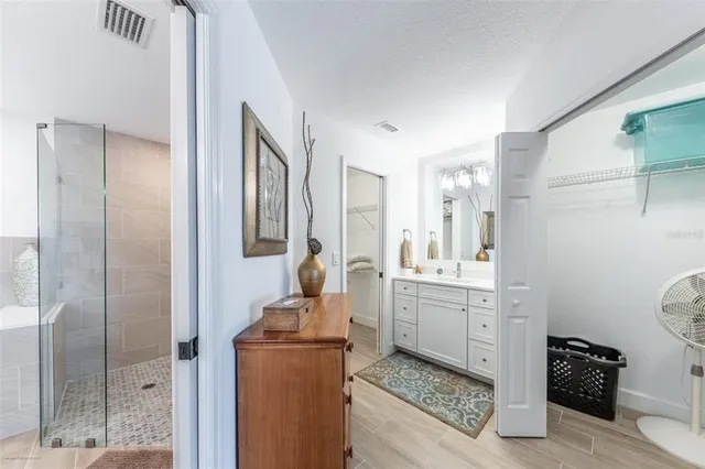 a bathroom with a toilet sink and shower