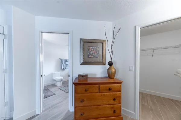 a bathroom with a tub sink and toilet