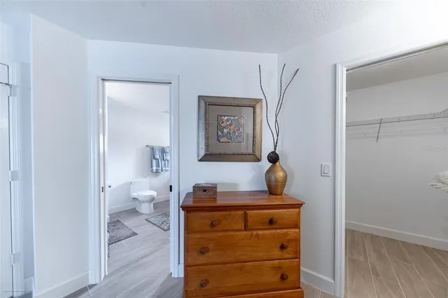 a bathroom with a tub sink and toilet