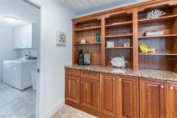 a view of a livingroom with furniture and a table