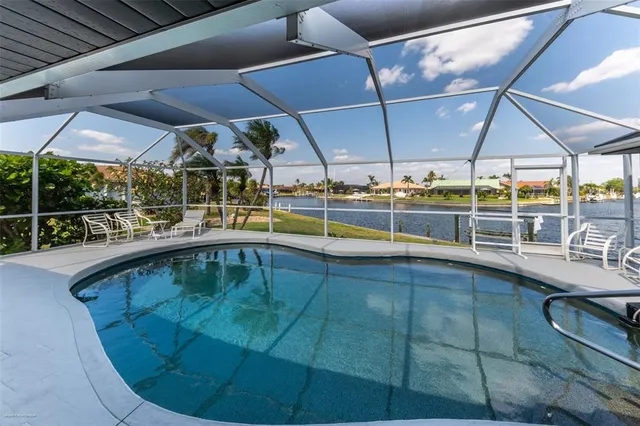 a view of a swimming pool with a patio