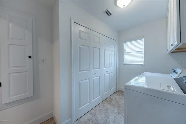 a bedroom with a bed and a night stand