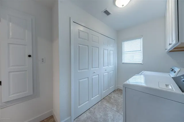 a bedroom with a bed and a night stand