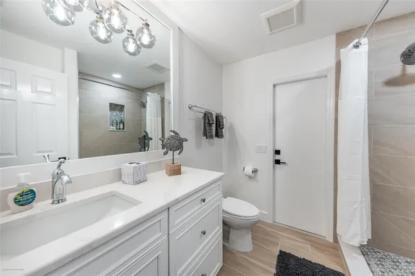 a bedroom with a bed and a table