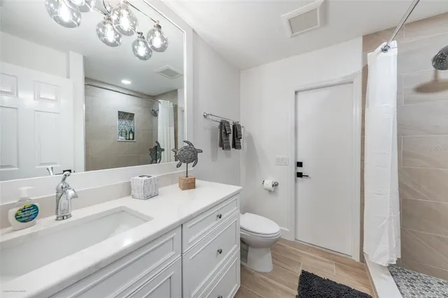 a bedroom with a bed and a table