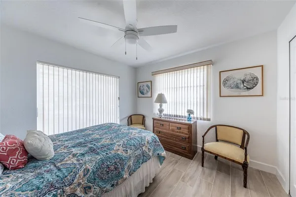 a living room with furniture and painting on the wall