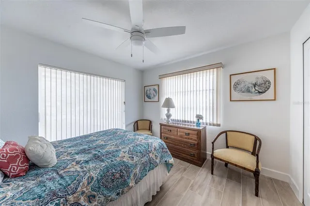 a living room with furniture and painting on the wall