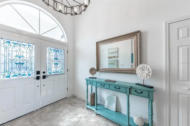 a living room with furniture and a lamp