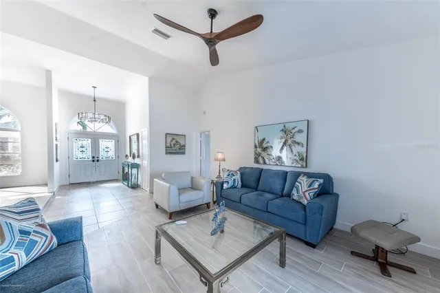 a living room with furniture and a lamp