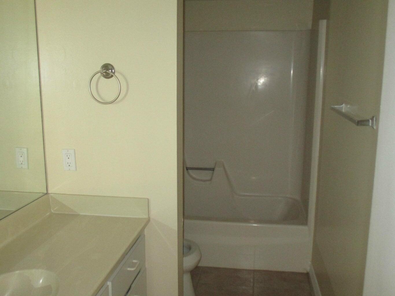 825 Center Street, Unit 3C Jupiter, FL 33458 - Photo 6 of 10 a bathroom with a shower