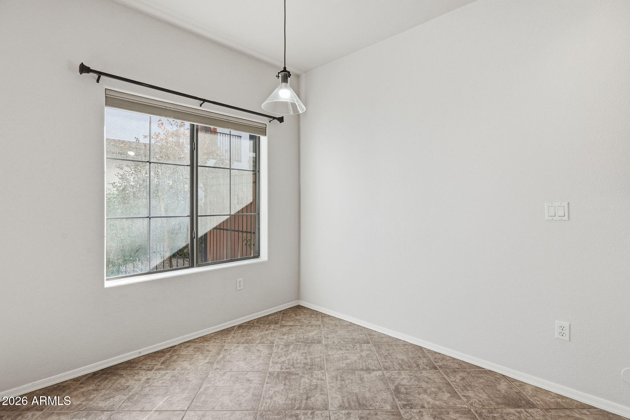 3150 East Beardsley Road, Unit 1064 Phoenix, AZ 85050 - Photo 12 of 30 an empty room with a window