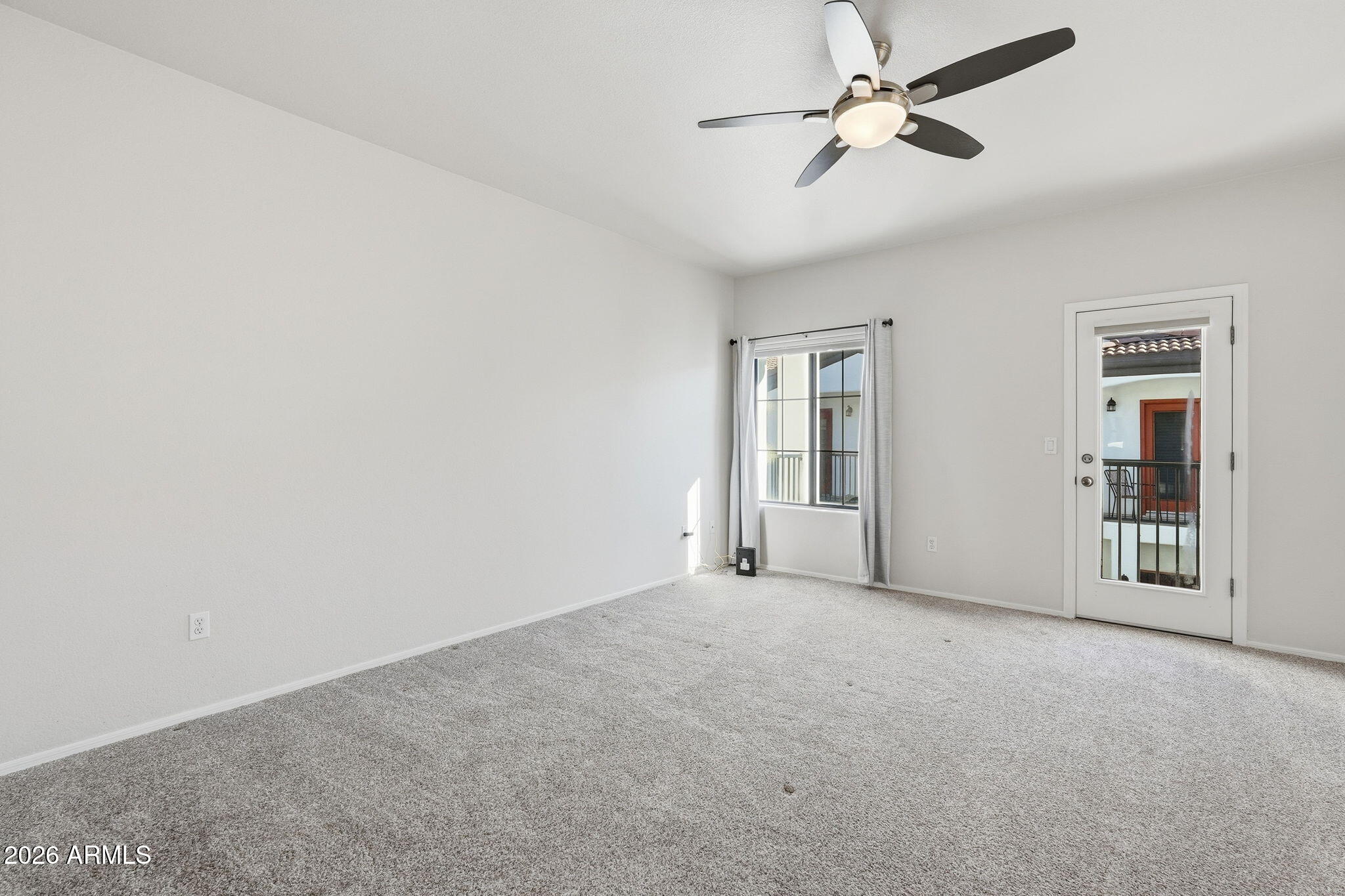 3150 East Beardsley Road, Unit 1064 Phoenix, AZ 85050 - Photo 13 of 30 a view of an empty room with a window