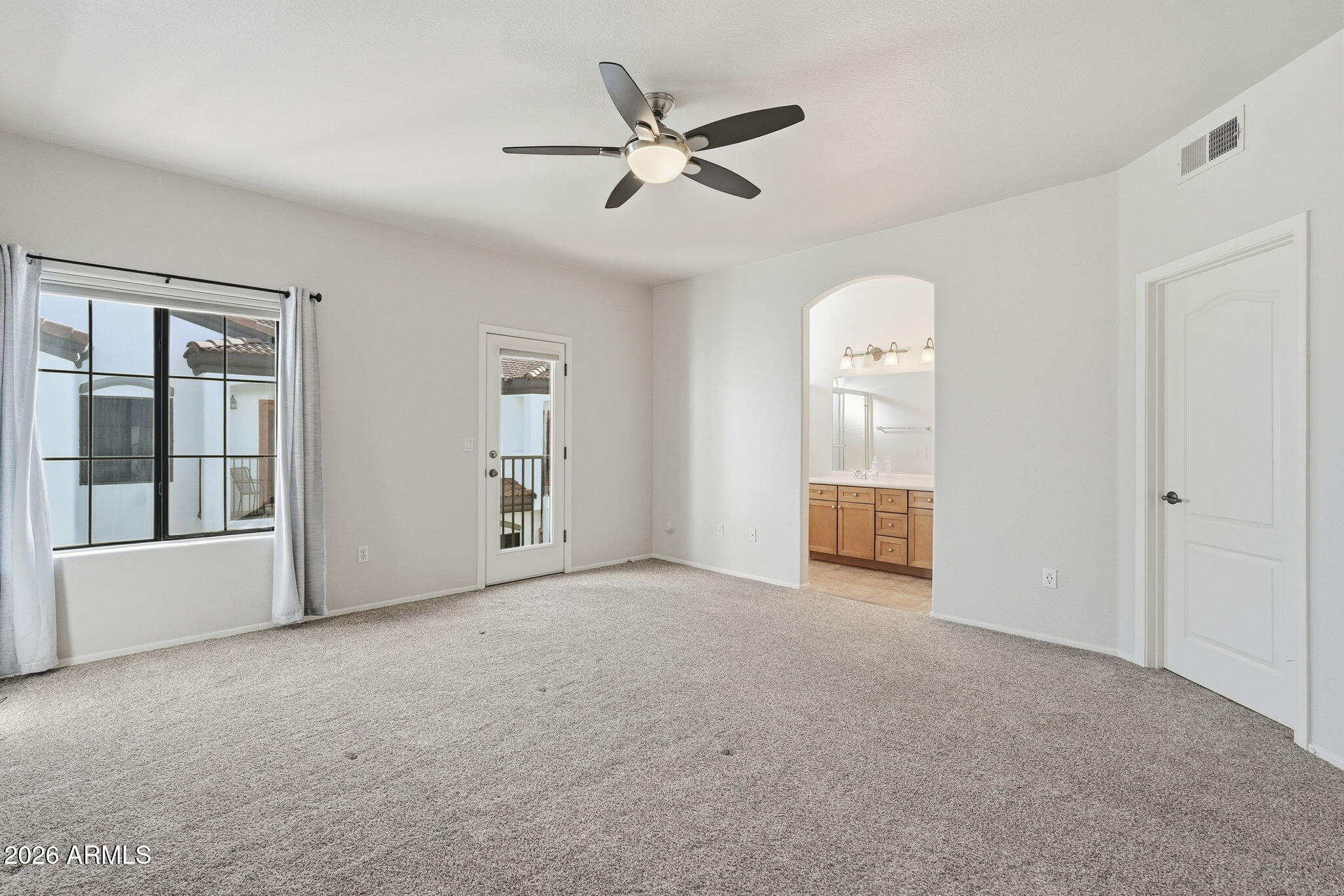 3150 East Beardsley Road, Unit 1064 Phoenix, AZ 85050 - Photo 14 of 30 a view of an empty room with a window