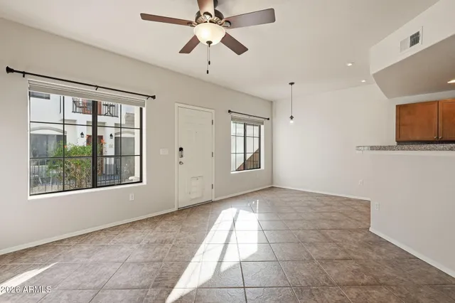 a very nice looking room with a ceiling fan