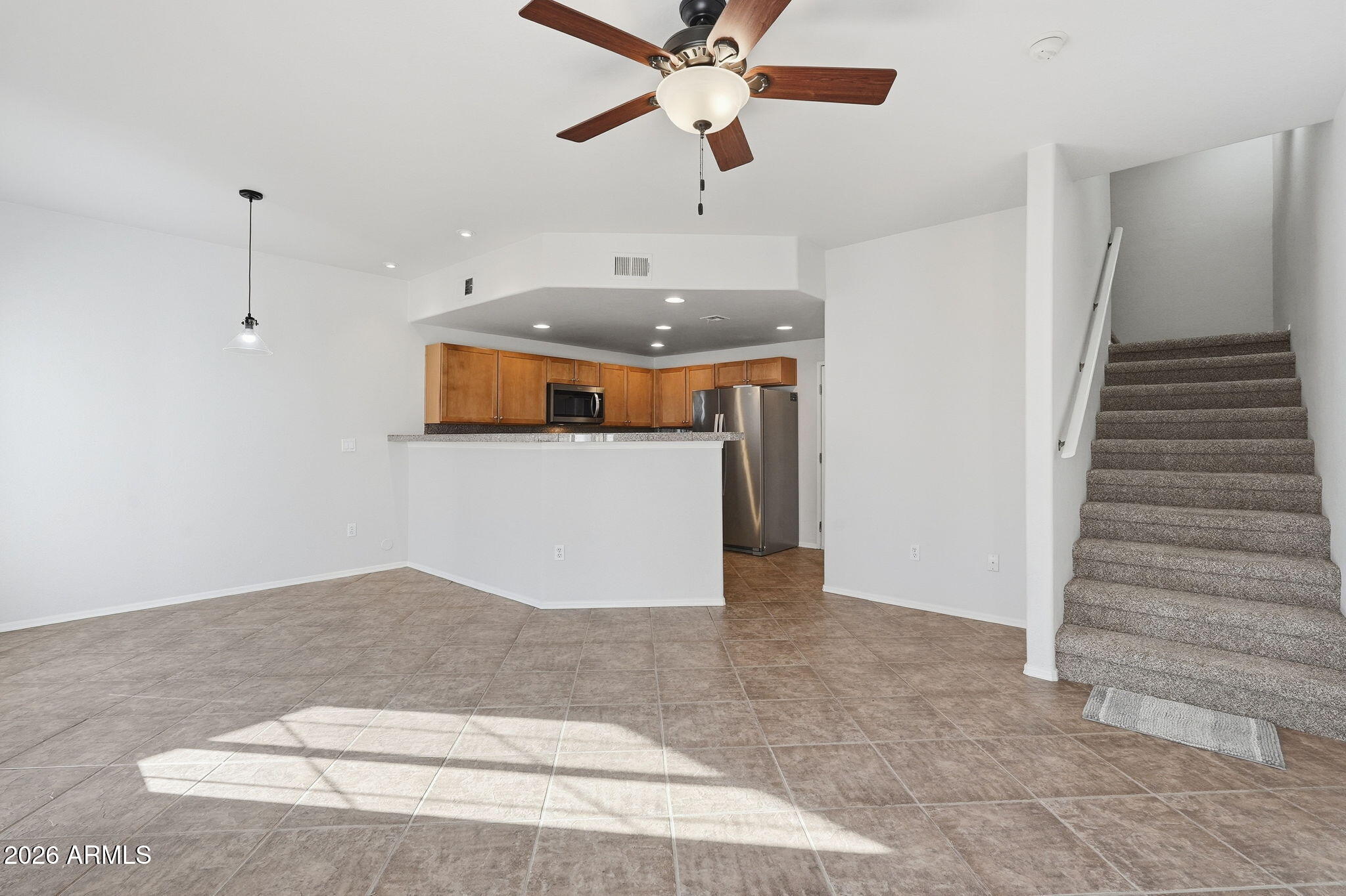 3150 East Beardsley Road, Unit 1064 Phoenix, AZ 85050 - Photo 6 of 30 a very nice looking room with a ceiling fan