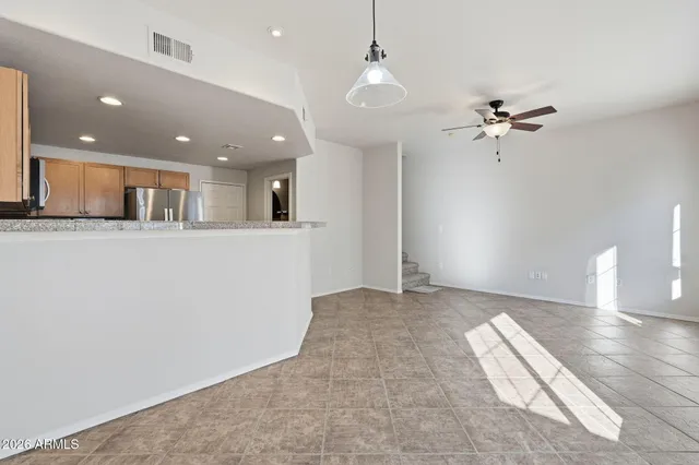 a kitchen with granite countertop a sink and a stove top oven