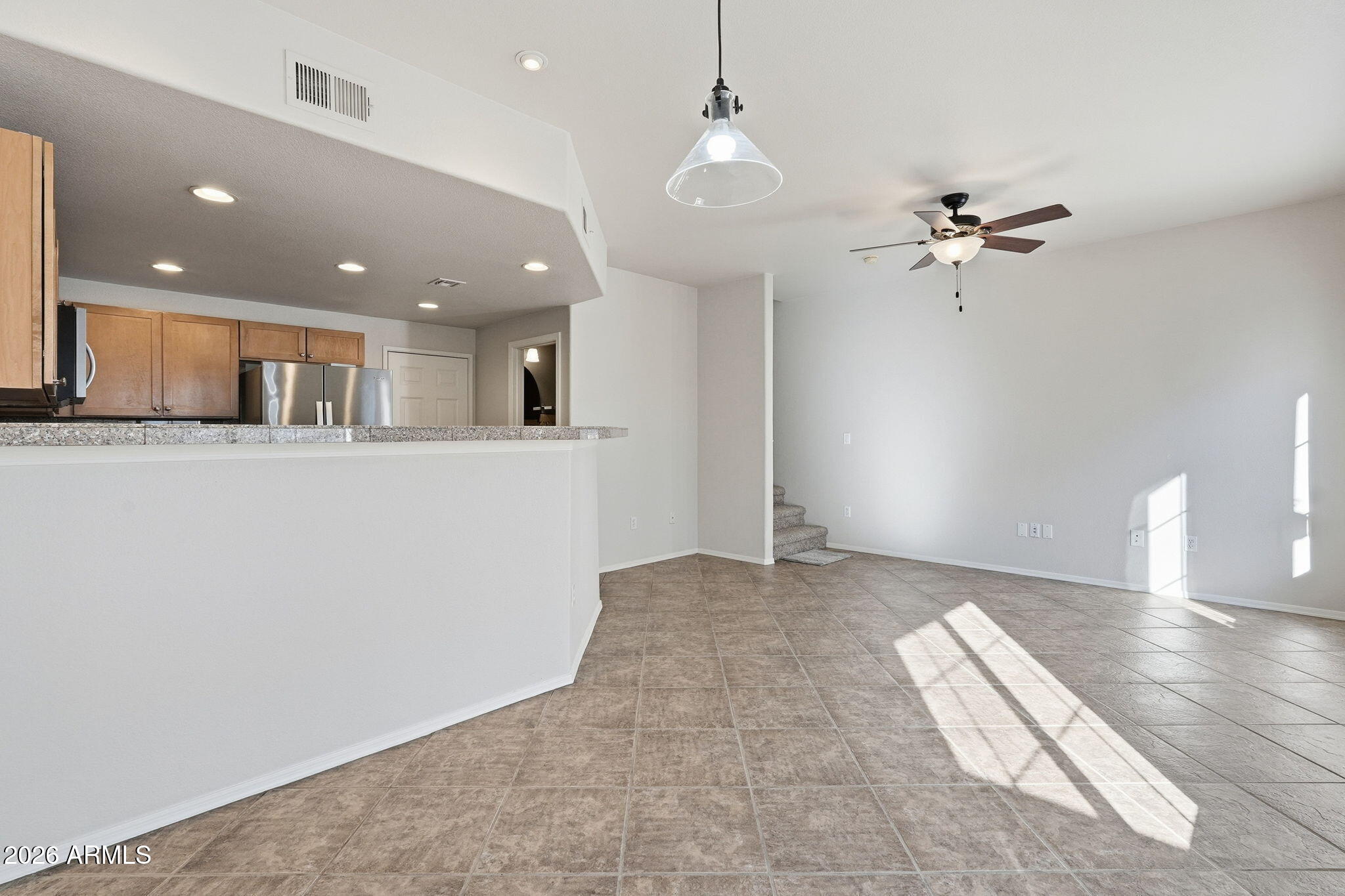 3150 East Beardsley Road, Unit 1064 Phoenix, AZ 85050 - Photo 7 of 30 a view of a kitchen with a sink and chandelier