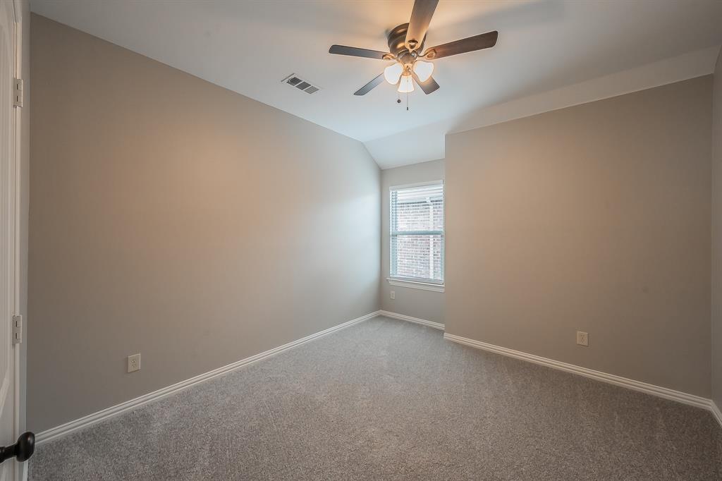 412 Hideaway Road McKinney, TX 75072 - Photo 35 of 40 an empty room with a window and a fan