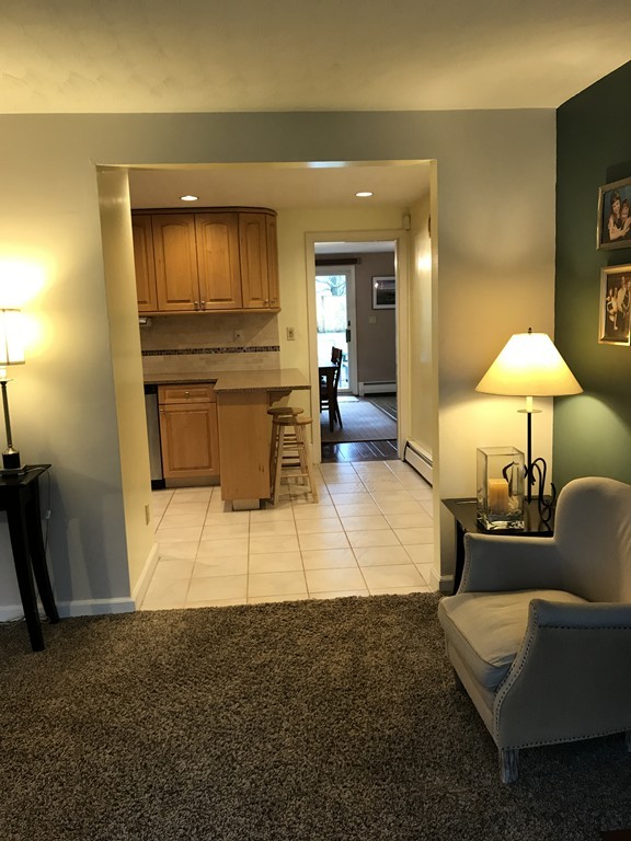 31 Elmfield Road Framingham, MA 01701 - Photo 7 of 25 a living room with furniture and a lamp