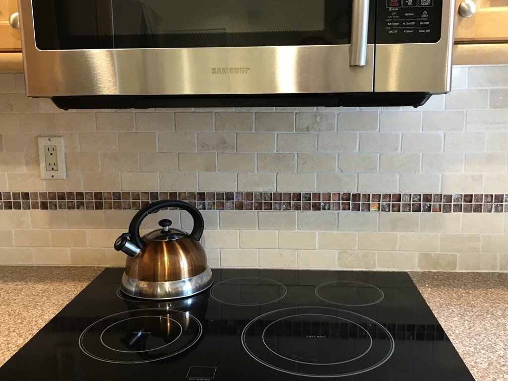 31 Elmfield Road Framingham, MA 01701 - Photo 9 of 25 a bathroom with a stove and a sink