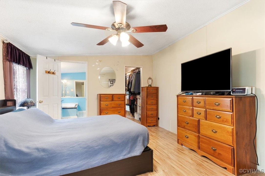 10340 Swift Road Partlow, VA 22534 - Photo 13 of 25 a bedroom with a bed and a flat screen tv
