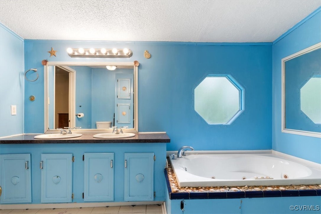10340 Swift Road Partlow, VA 22534 - Photo 15 of 25 a bathroom with a granite countertop sink and a mirror