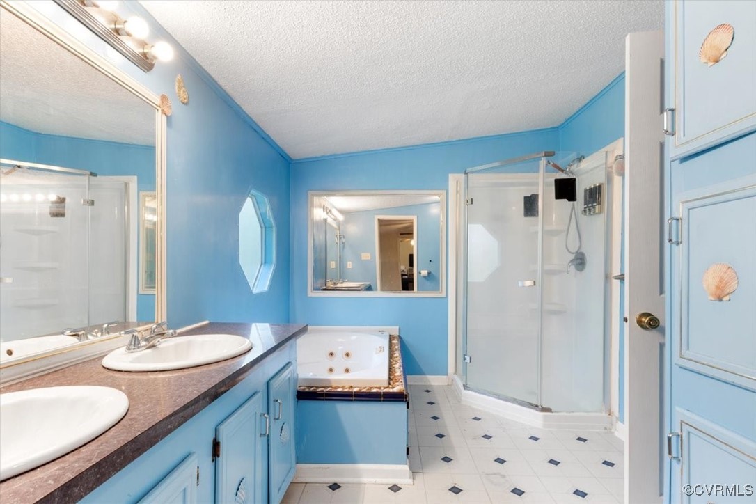 10340 Swift Road Partlow, VA 22534 - Photo 16 of 25 a bathroom with a sink double vanity granite tub shower and mirror