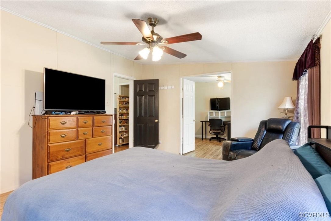10340 Swift Road Partlow, VA 22534 - Photo 17 of 25 a bedroom with furniture and a flat screen tv