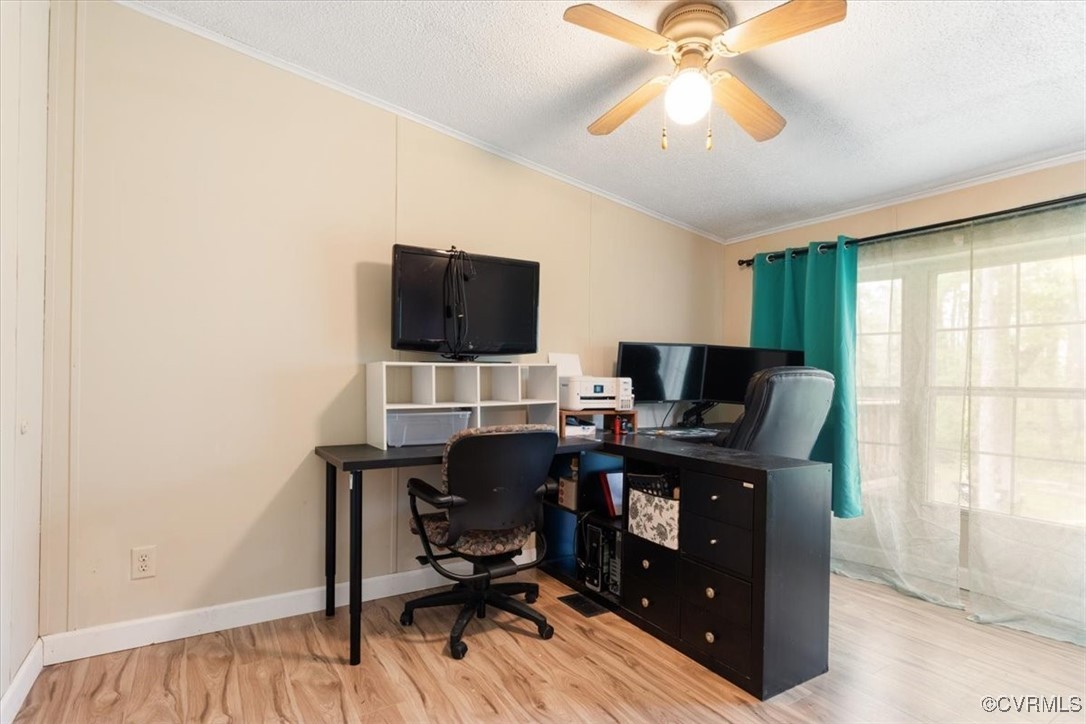 10340 Swift Road Partlow, VA 22534 - Photo 18 of 25 a view of a workspace with furniture and a window