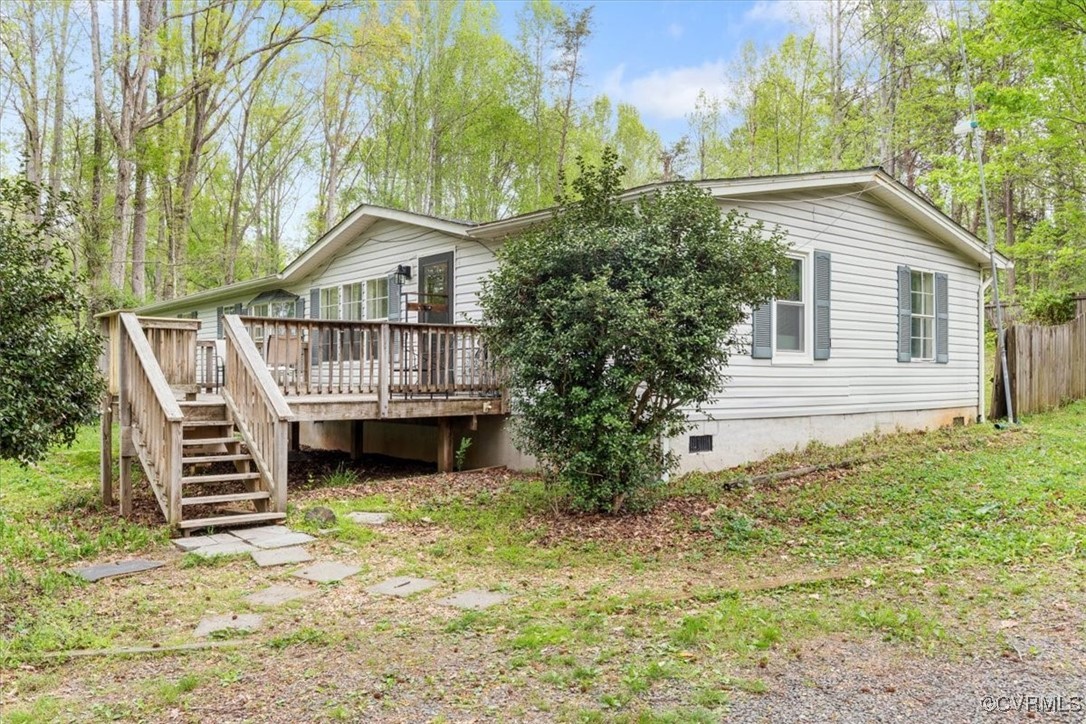 10340 Swift Road Partlow, VA 22534 - Photo 2 of 25 a house with trees in front of it