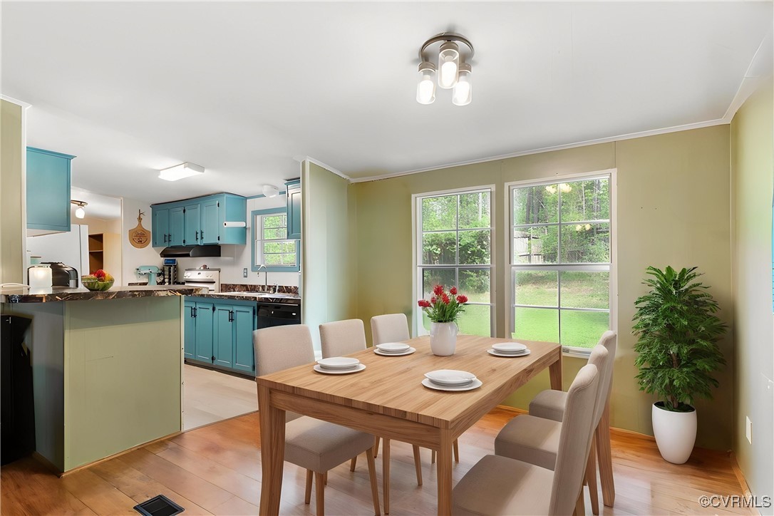 10340 Swift Road Partlow, VA 22534 - Photo 6 of 25 a view of a dining room with furniture window and wooden floor