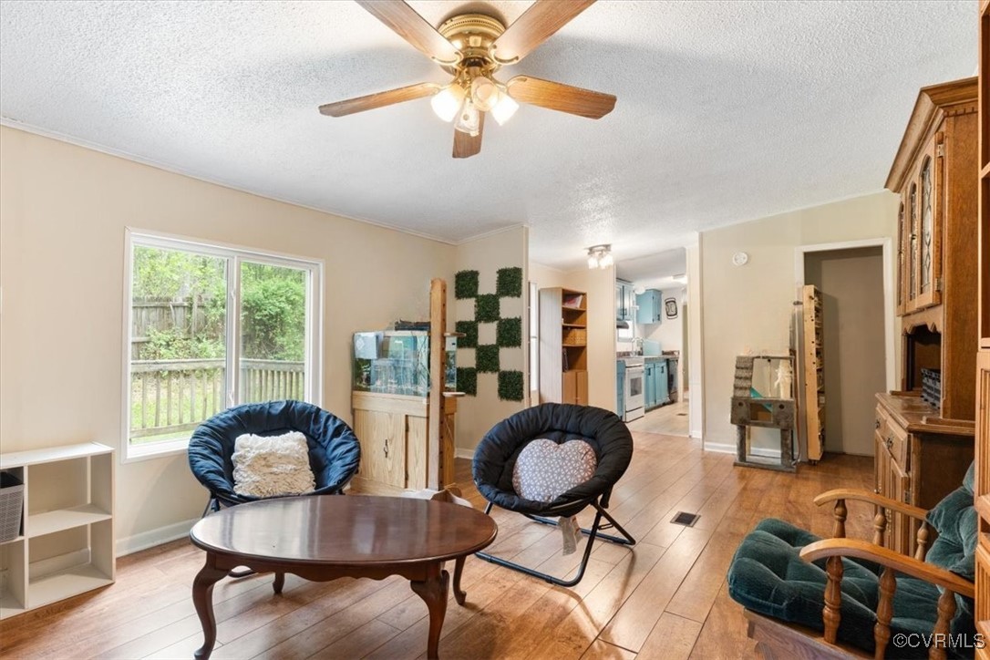 10340 Swift Road Partlow, VA 22534 - Photo 10 of 25 a living room with furniture and a chandelier