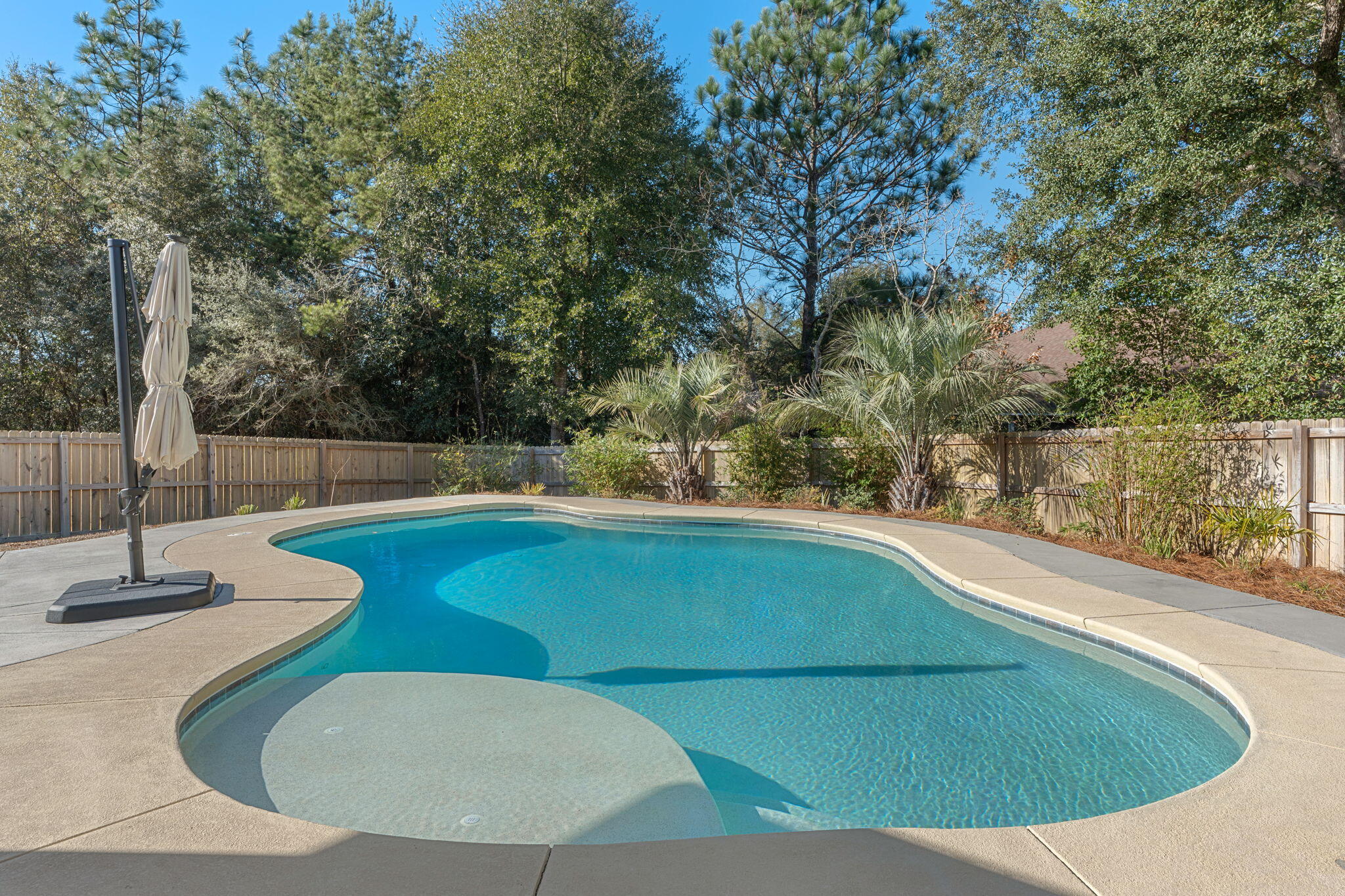 207 Pinque Coat Court Crestview, FL 32536 - Photo 2 of 47 a view of a swimming pool with a patio