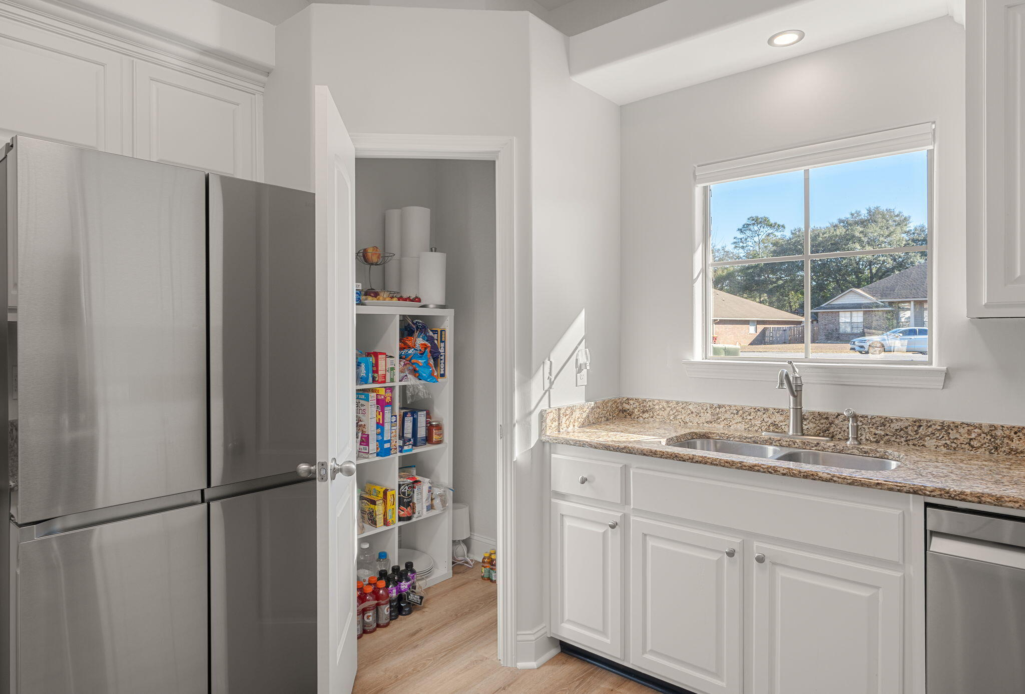 207 Pinque Coat Court Crestview, FL 32536 - Photo 21 of 47 a kitchen with stainless steel appliances granite countertop a refrigerator and a sink