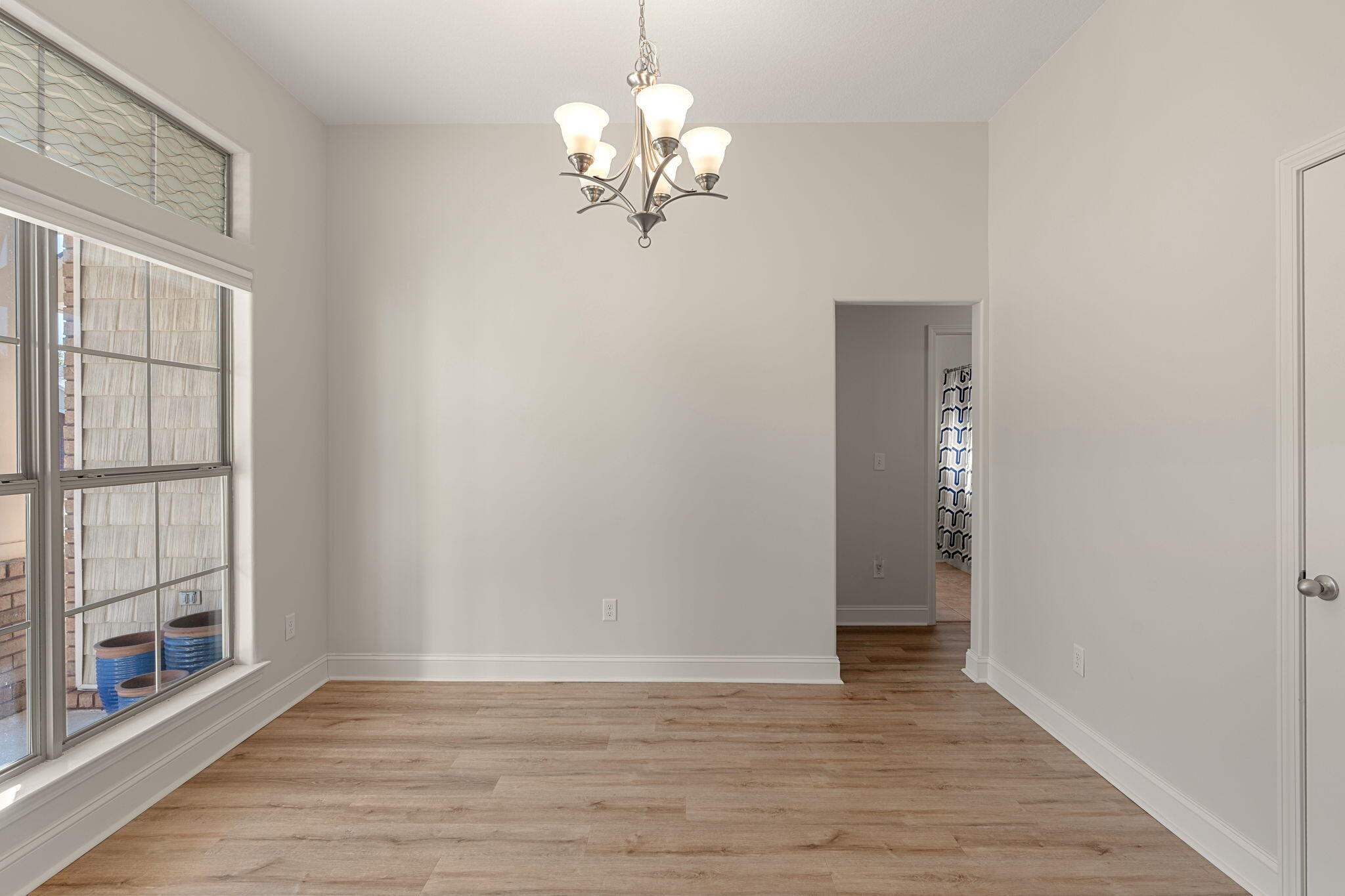 207 Pinque Coat Court Crestview, FL 32536 - Photo 22 of 47 a view of a livingroom with a chandelier