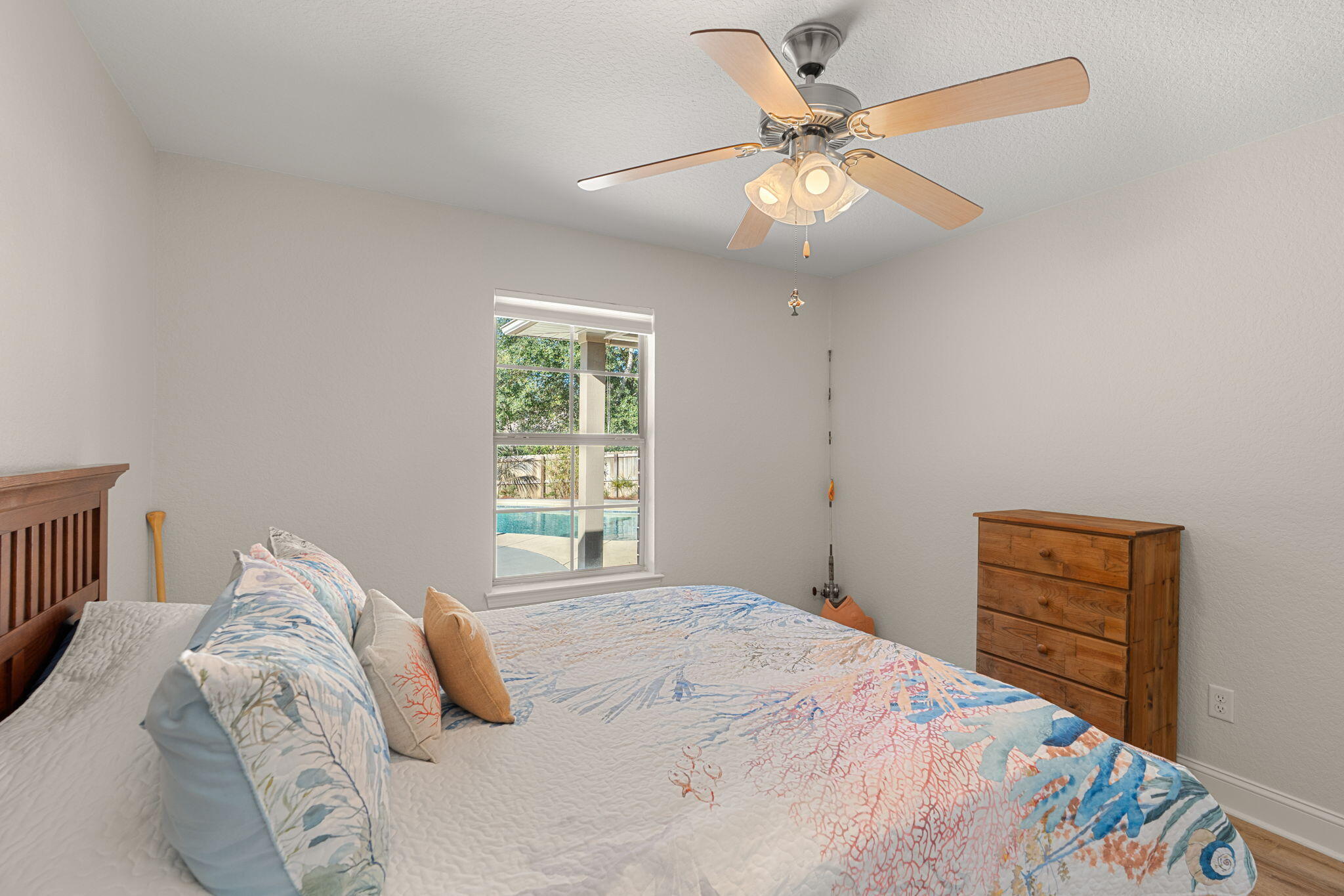 207 Pinque Coat Court Crestview, FL 32536 - Photo 30 of 47 a bedroom with a bed and a chandelier